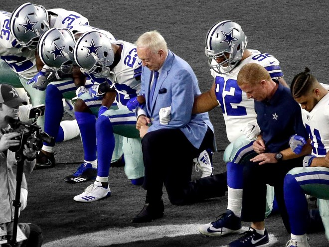 cowboys jones kneel.jpg